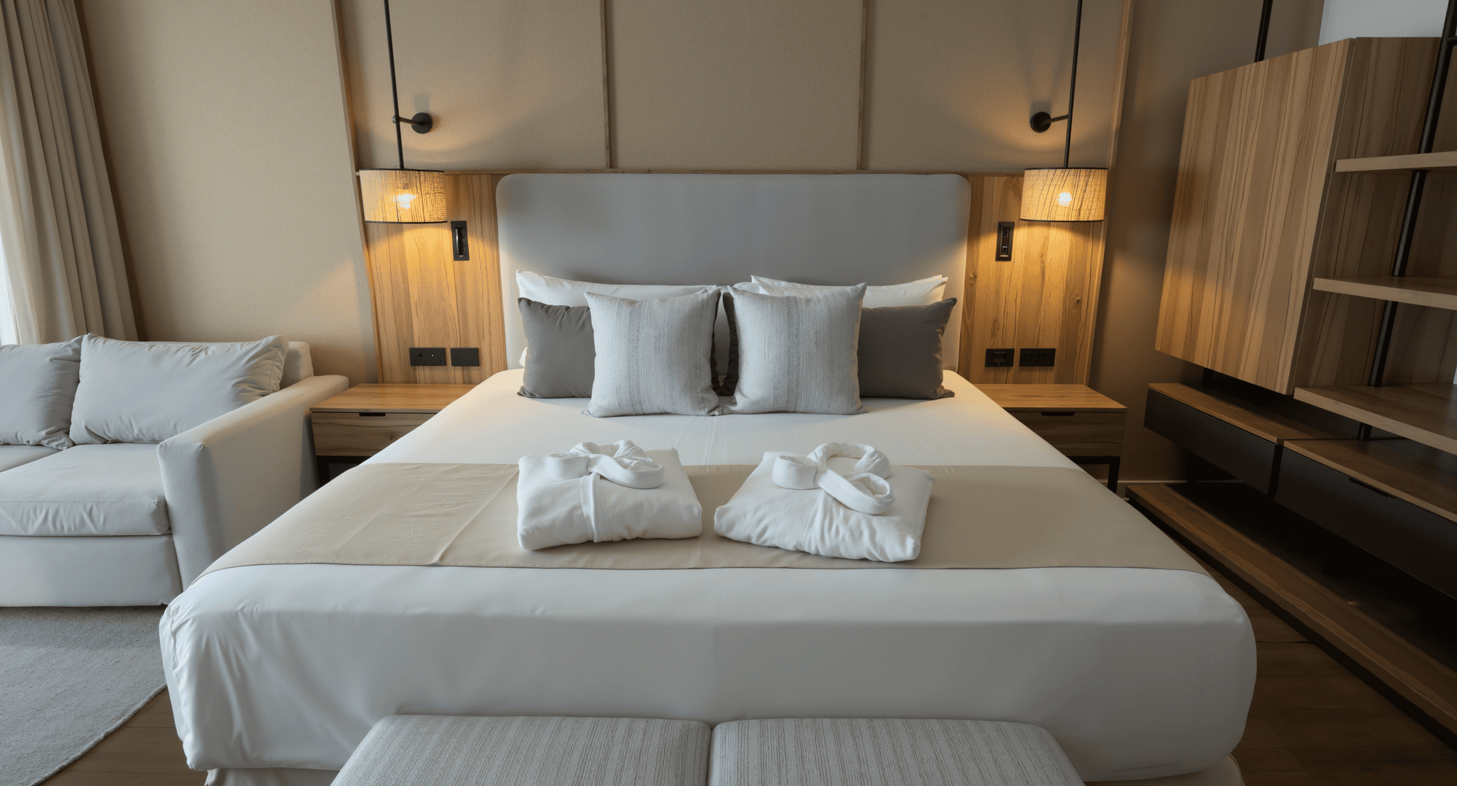 Modern hotel bedroom featuring plush bedding and contemporary decor at Santo Domingo Bay Boca Chica.